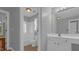 Bright bathroom with white cabinetry, granite counters, and tiled shower at 229 Shillings Chase Dr, Cary, NC 27518