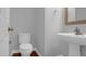 A well-lit bathroom features a pedestal sink and modern fixtures at 229 Shillings Chase Dr, Cary, NC 27518