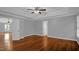 Spacious main bedroom with hardwood floors, two large closets, and an ensuite bathroom at 229 Shillings Chase Dr, Cary, NC 27518