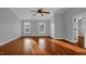 Large bedroom with two windows, a ceiling fan, and an ensuite bathroom at 229 Shillings Chase Dr, Cary, NC 27518