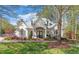 Charming clubhouse with beautiful architectural details, including arched windows and a manicured lawn at 229 Shillings Chase Dr, Cary, NC 27518