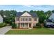 Lovely brick home with a spacious front yard, black shutters, and attached garage at 229 Shillings Chase Dr, Cary, NC 27518