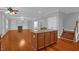 Open-concept kitchen adjacent to the living room with center island and stainless appliances at 229 Shillings Chase Dr, Cary, NC 27518