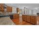 Well-appointed kitchen showcases granite counters, wood cabinets, and modern appliances at 229 Shillings Chase Dr, Cary, NC 27518