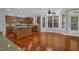Spacious kitchen with an island, wood cabinets, granite countertops, stainless steel appliances, and a large window at 229 Shillings Chase Dr, Cary, NC 27518