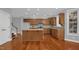 Modern kitchen with an island, wood cabinets, and stainless steel appliances at 229 Shillings Chase Dr, Cary, NC 27518