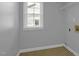 This laundry room has ample natural light from the window and has convenient shelving for storage at 229 Shillings Chase Dr, Cary, NC 27518