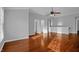 Spacious living room with hardwood floors, neutral paint colors, and a ceiling fan at 229 Shillings Chase Dr, Cary, NC 27518