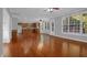 Open living area with gleaming hardwood floors and plenty of natural light at 229 Shillings Chase Dr, Cary, NC 27518