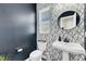 Elegant half-bathroom with designer wallpaper, modern fixtures, and a stylish pedestal sink at 240 S Stonehaven Way, Clayton, NC 27527