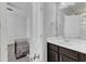 Bathroom featuring cabinets with a sink and a dog crate in another room at 240 S Stonehaven Way, Clayton, NC 27527