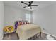 Cozy bedroom featuring a ceiling fan, stylish pillows and a unique yellow chair for a modern touch at 240 S Stonehaven Way, Clayton, NC 27527