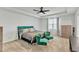 Spacious bedroom featuring a trey ceiling, a large bed, and two upholstered chairs at 240 S Stonehaven Way, Clayton, NC 27527