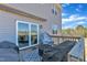 Back deck with covered furniture, overlooking the backyard at 240 S Stonehaven Way, Clayton, NC 27527