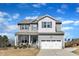 Charming two-story home featuring a covered front porch and a two-car garage at 240 S Stonehaven Way, Clayton, NC 27527