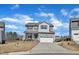 Charming two-story home featuring a covered front porch and a two-car garage at 240 S Stonehaven Way, Clayton, NC 27527