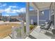 Inviting front porch with comfortable seating, perfect for relaxing outdoors at 240 S Stonehaven Way, Clayton, NC 27527
