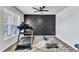 Well-equipped home gym with modern decor and workout equipment at 240 S Stonehaven Way, Clayton, NC 27527