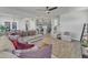 Open-concept living area with plush sectional, armchairs, and views into the kitchen at 240 S Stonehaven Way, Clayton, NC 27527