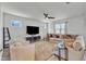 A spacious living room includes a ceiling fan, television, and plush seating arrangement at 240 S Stonehaven Way, Clayton, NC 27527