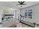 Bright living area featuring a ceiling fan, fitness equipment, bench, and ample natural light at 240 S Stonehaven Way, Clayton, NC 27527