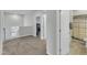 Upstairs loft area with carpet flooring, a window and doorways to the bathroom and a bedroom at 240 S Stonehaven Way, Clayton, NC 27527