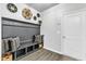 Functional mudroom with built-in bench, storage cubbies, hooks, and decorative wall baskets at 240 S Stonehaven Way, Clayton, NC 27527