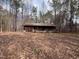 A log cabin style home with a full porch and a wooded lot at 2408 Homestead Road Rd, Chapel Hill, NC 27516