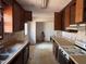 Outdated kitchen features old cabinets and dirty counters at 2408 Homestead Road Rd, Chapel Hill, NC 27516