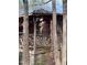 Corner of porch of wooded cabin with decorative railing at 2408 Homestead Road Rd, Chapel Hill, NC 27516