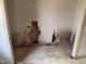 Image shows a room with severe wall damage, exposing interior structures and debris littering the floor at 2408 Homestead Road Rd, Chapel Hill, NC 27516