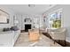 Spacious living room with hardwood floors, stylish furniture, and a decorative fireplace at 2524 Banner St, Durham, NC 27704