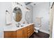 Bathroom features a double vanity, modern fixtures, and tiled shower at 300 Finsbury # 115, Durham, NC 27703