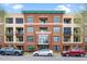 Beautiful brick condo building with multiple levels and parking available in front on a clear day at 300 Finsbury # 115, Durham, NC 27703