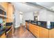 This kitchen features stainless steel appliances and wood cabinetry at 300 Finsbury # 115, Durham, NC 27703