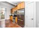 Kitchen featuring stainless steel appliances, wooden cabinets, and ample countertop space for a functional design at 300 Finsbury # 115, Durham, NC 27703