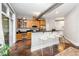 Open-concept kitchen with stainless steel appliances, bar-style seating, and natural light at 300 Finsbury # 115, Durham, NC 27703