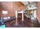Lobby featuring exposed brick, a modern staircase, and stylish seating, creating a welcoming atmosphere at 300 Finsbury # 115, Durham, NC 27703