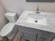Bathroom featuring a vanity with elegant marble-style countertop and toilet at 3616 Open Sight Ct, Raleigh, NC 27616