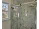 Beautiful bathroom features a glass shower enclosure with handrails and tiled walls at 3616 Open Sight Ct, Raleigh, NC 27616