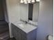 Bathroom featuring a gray vanity with light countertop and modern fixtures at 3616 Open Sight Ct, Raleigh, NC 27616