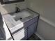 Bathroom vanity with gray cabinetry, granite countertop, and white vessel sink at 3616 Open Sight Ct, Raleigh, NC 27616