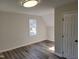 Bedroom with wood flooring, a flush mount light, and a double window at 3616 Open Sight Ct, Raleigh, NC 27616