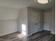 Bedroom featuring hardwood floors, natural light and built-in closets at 3616 Open Sight Ct, Raleigh, NC 27616