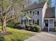 Beautiful two-story home boasts a manicured lawn and mature landscaping at 3616 Open Sight Ct, Raleigh, NC 27616