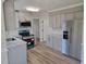 New kitchen with gray cabinets, stainless appliances, and granite countertops at 3616 Open Sight Ct, Raleigh, NC 27616