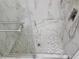 Sleek shower with elegant marble-patterned tile and a mosaic tiled floor at 3616 Open Sight Ct, Raleigh, NC 27616
