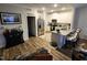 Modern kitchen with white cabinets, stainless steel appliances, and a center island with seating and lots of light at 400 Access Dr, Youngsville, NC 27596