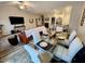 Bright living space featuring wood-look floors, an open floor plan, and a dining table with seating for six at 400 Access Dr, Youngsville, NC 27596