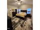 Spacious main bedroom features a large bed, neutral walls, ceiling fan, and ensuite bath and walk-in closet at 400 Access Dr, Youngsville, NC 27596